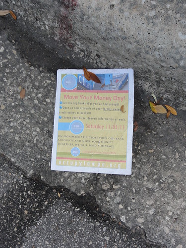 An Occupy Tampa flyer lies in the gutter