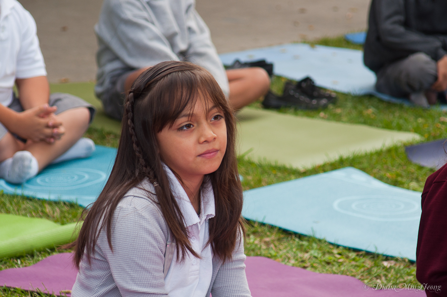 Gabrielle Lagman teaching yoga to Vaughn Elementary School