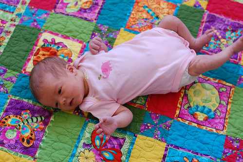 Eva on a quilt from Granny