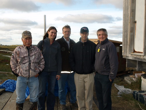 Left – Right, President of the Village of Kwigillingok, Johnny Friend, joins Tasha Deardorff, Matt Dixon, Jonathan Adelstein and Jim Nordlund at a site where RAVG funded a flush, tank and haul upgrade for a village home.