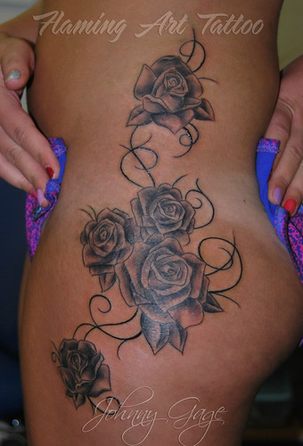 roses on thigh and hip tattoo Tattooed by Johnny at Flaming Art Tattoo