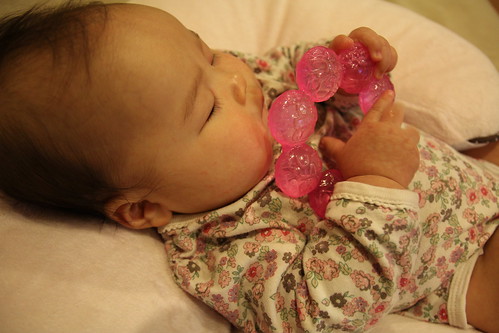 With her teether.