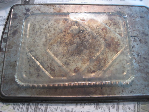 the gelatin plate sitting on the bottom of a nasty looking cookie sheet