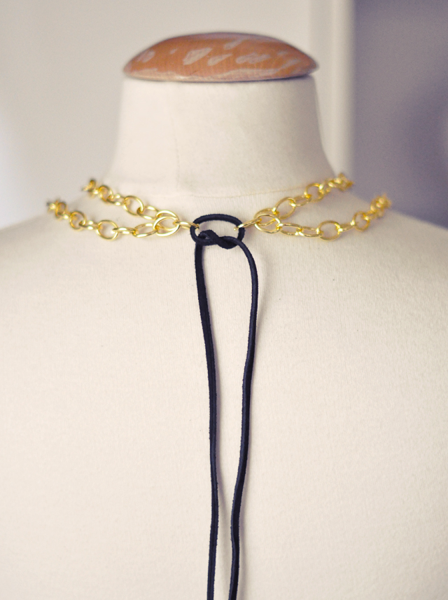 gilded necklace with gemstones and  gold chains