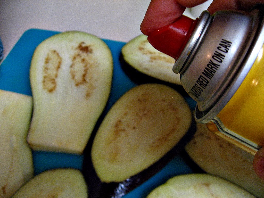 spraying eggplant to grill