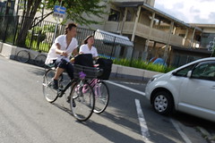 Cycling high school students near Nijo Castle Kyoto
