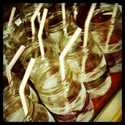charming lace and purple ribbon on mason jars