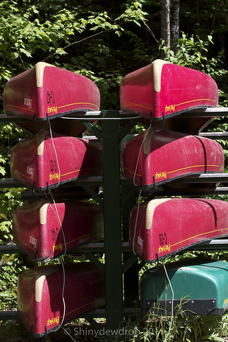 Stacks of canoes ready to be pulled off the rack