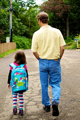 Walking to the bus stop with Daddy.