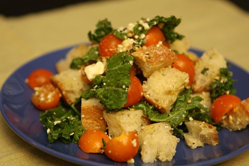 Honeyed Kale Salad with Feta, Sun Gold Tomatoes, Lemon, Bread, and Basil