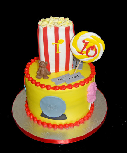 carnival themed 10th birthday cake popcorn, sucker, teddy bear, crystal ball