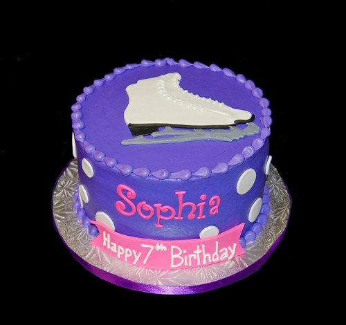 purple  and white polka dot ice skating birthday cake