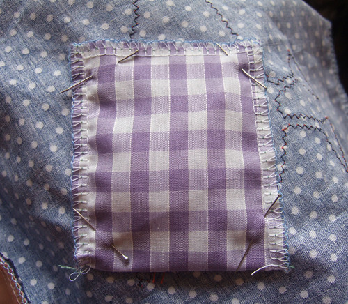 pouch pinned to back of bird square