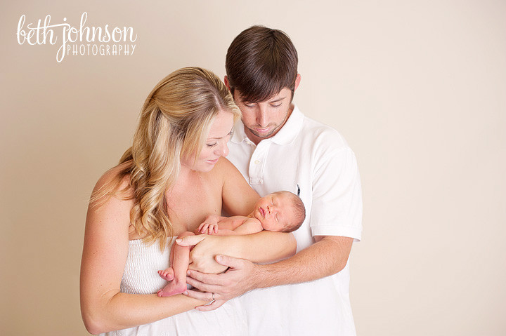 newborn baby with his parents in tallahassee studio photographer