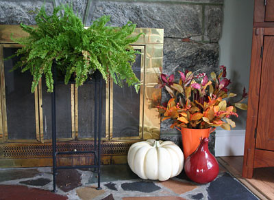 Beginning of fall display by fireplace