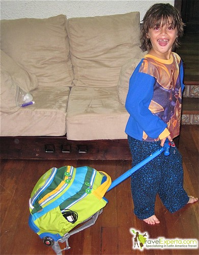 kid holding a jworld rolling backpack 