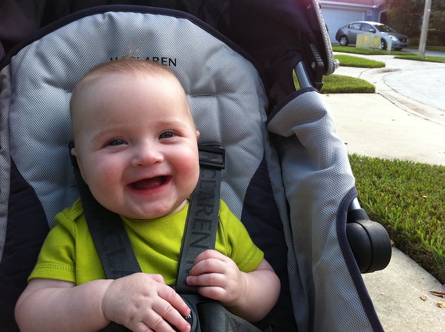 George happy in his stroller.