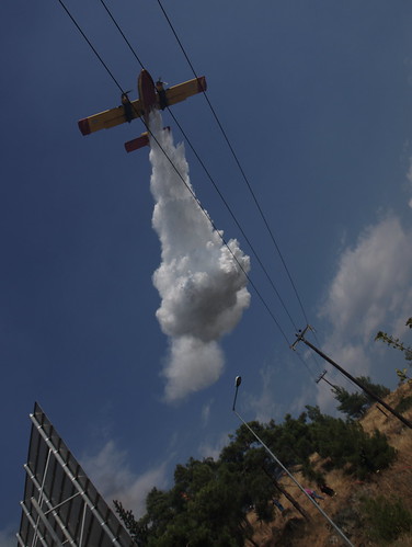 Greek fire fighting airplane dropping water on fire outside northern port city of Thessaloniki by Teacher Dude's BBQ