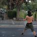 Young Greek protester taunting riot police protecting prime minister duing visit to northern port city of Thessaloniki
