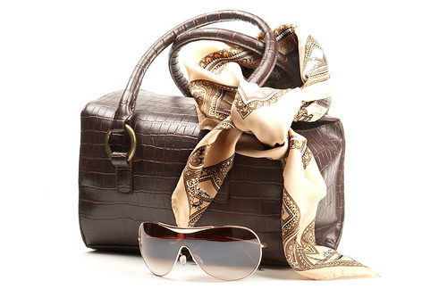 Brown bag, spectacles and scarf