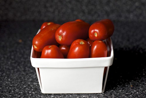 a basket of plum tomatoes