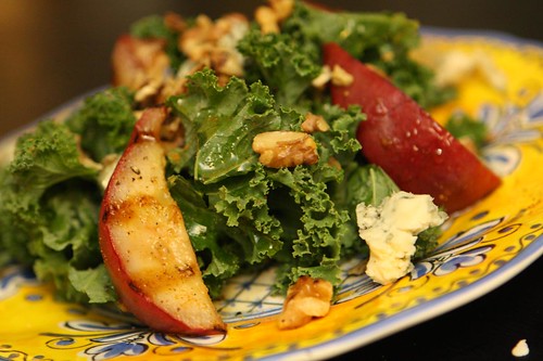 Grilled Red Clapp Pears with Kale, Toasted Walnuts, Sambar Powder, and Fourme d'Ambert