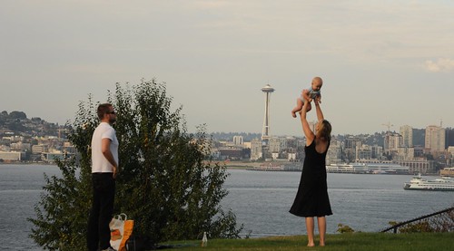 Baby boy - this - this is your town, love, Mom and Pop! Seattle Space Needle, Puget Sound, ferry, buildings, view from a park, West Seattle, Washington, USA by Wonderlane