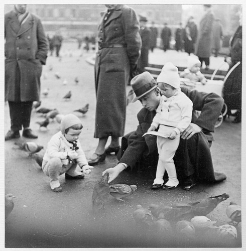 Children feeding pigeons in Leipzig, Germany 1937