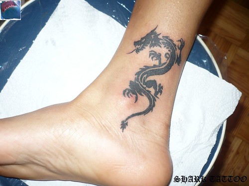 tribal dragon tattoo by