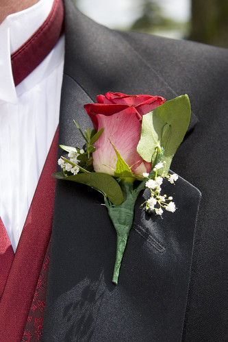 One of our most popular boutonnieres this beautiful single red Rose