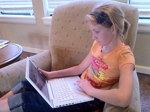 Sarah watching Netflix on a laptop