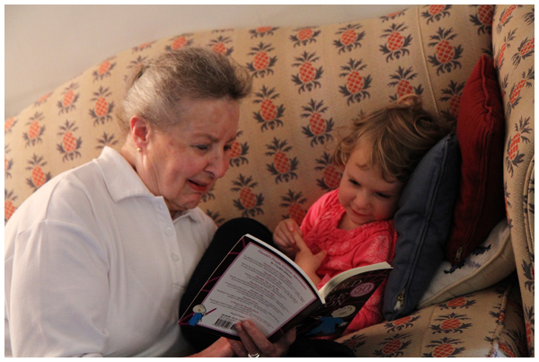 Reading activities: toddler reading with great grandma