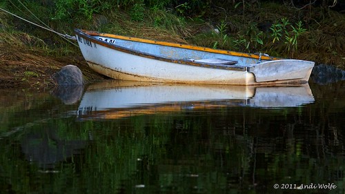 Row boat reflection by andiwolfe