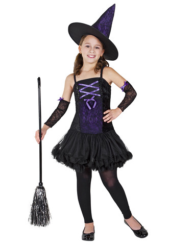 A young girl in a 2011 Witch Costume, complete with corset and lace arms. She is standing with her arm on her hip