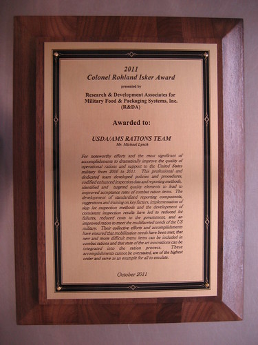 A photograph of the Colonel Rohland Isker Award given to the USDA/AMS Rations Team.  Members of the USDA staff are being recognized for their efforts to ensure only top quality products reach our troops. 
