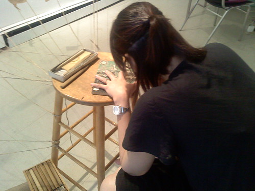 Min-Chi working on woodcut