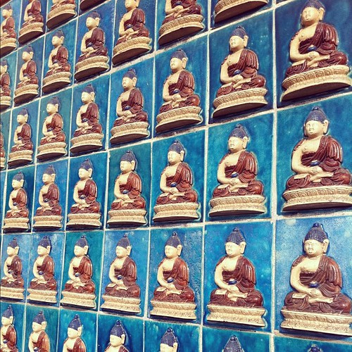 Glazed #Budha tiles on the wall of the White #Pagoda at #BeihaiPark in #Beijing #China. #obievip  #obievip_china by ObieVIP