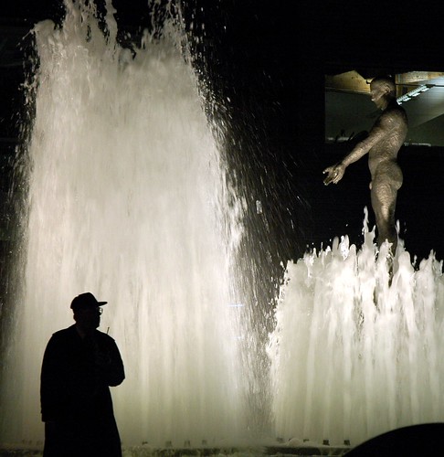 Dimensional - Olympic Sculpture Park Fountain security guard with walkie-talkie, nude male statue, night, Seattle waterfront area, Washington State, USA by Wonderlane