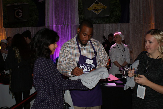 PERCY HARVIN with Second Harvest Heartland employees Lindsi and Heidi