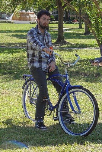 Guy on a bike with an orange armband