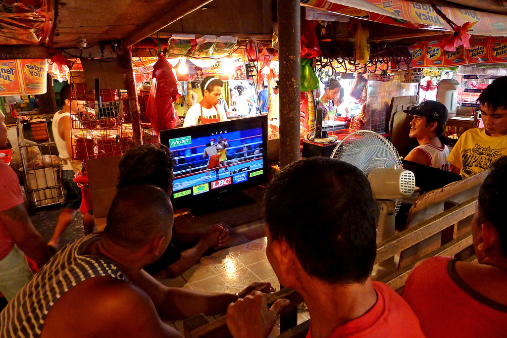 Meat vendors in Agdao Market, Davao City on Sunday, November 12 takes a break as they watch the undercard fights ahead of Pacquiao-Marquez fight by lunchtime.