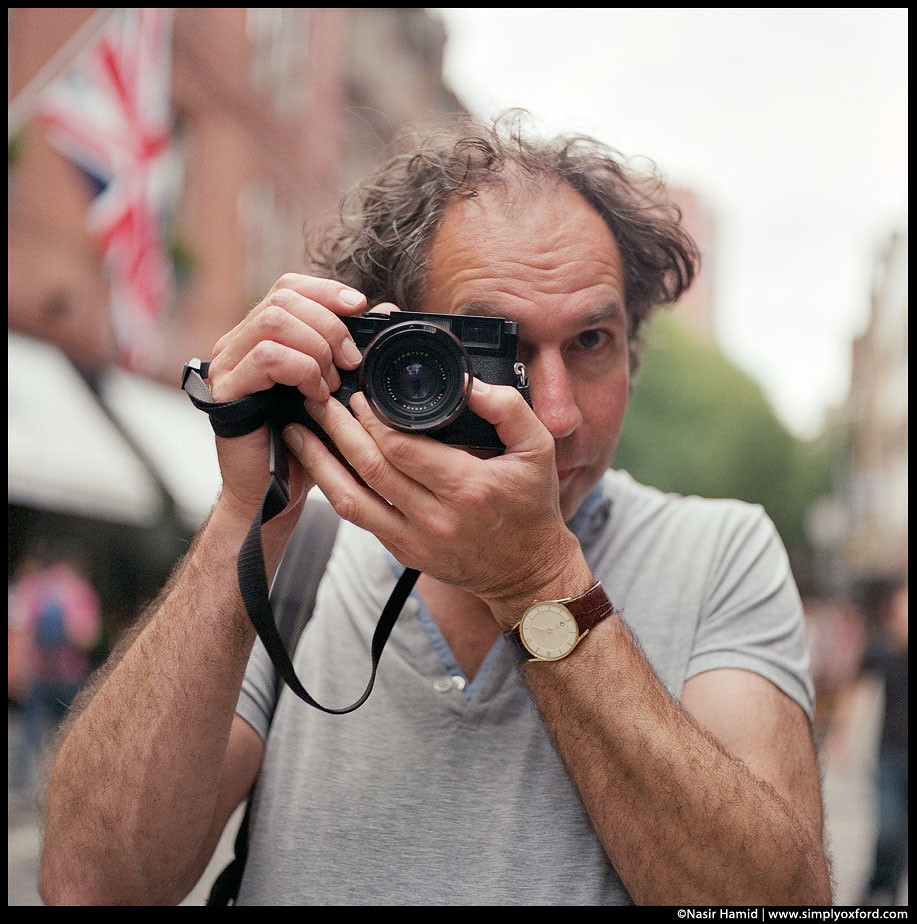Man holding a Leica camera
