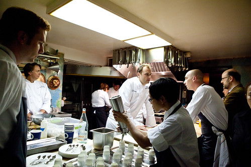 Busy in the kitchen: sous chefs prepping Humm's hors d'oeurves, Chef Humm talking to one of his sous