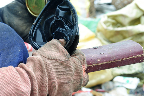 A hand of a woman scavenger that segregates recyclabes at the Inayawan landfill.