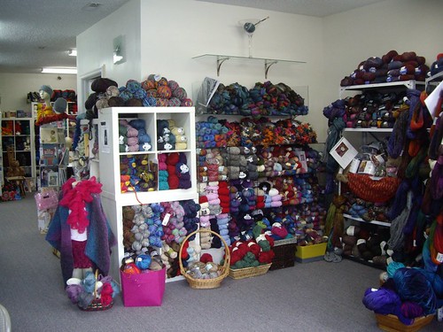 The fully stocked shelves of yarn to greet everyone