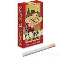 box of machismo brand candy cigarettes with a cowboy on the front and a cigarette sitting in front of it