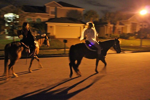 Trick-or-treaters on horseback