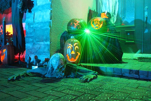 Remote-controlled zombie, pumpkins, and laser light