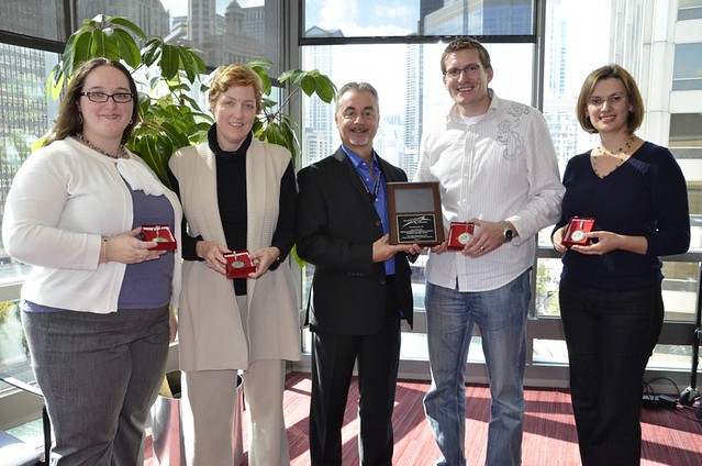 NIU Faculty Development and Instructional Design Center Staff receiving award from Ken Sadowski