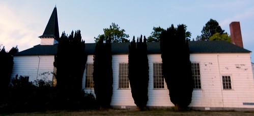 Fort Lawton church, overgrown topiary trees, windows, steeple, Discovery Park, Seattle, Washington, USA by Wonderlane